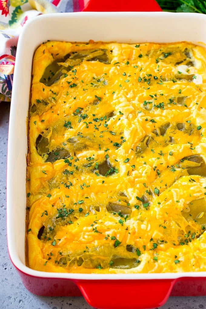 Chile Relleno Casserole Recipe | Baked Chile Rellenos | Mexican Casserole #casserole #chiles #mexican #cheese #dinner #ezlod A dish of chile relleno casserole topped with cheddar cheese and chopped cilantro.