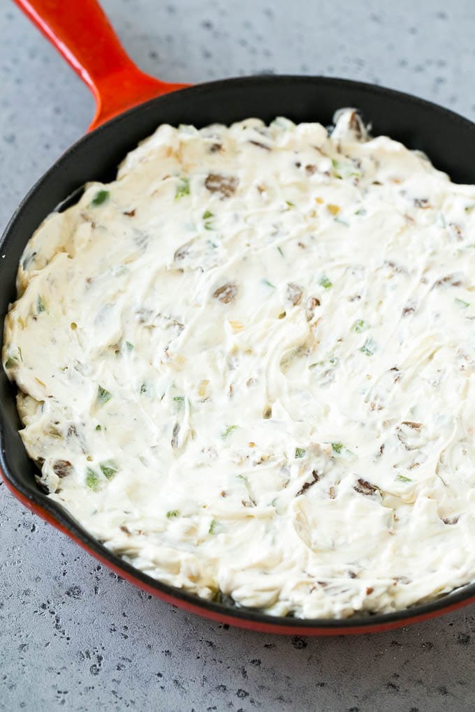 Philly Cheesesteak Dip Recipe | Cheesy Dip | Baked Cheese Dip #steak #dip #appetizer #cheese #ezlod Steak, peppers and onions in a skillet, mixed with cream cheese.
