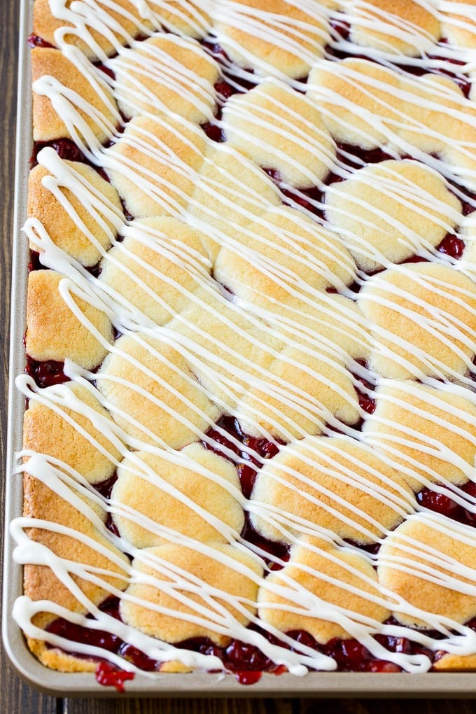 Cherry Bars Recipe | Cherry Pie Bars | Cherry Cookies | Bar Cookies #cookies #bars #cherry #baking #dessert #sweets #ezlod Cherry bars topped with vanilla glaze.