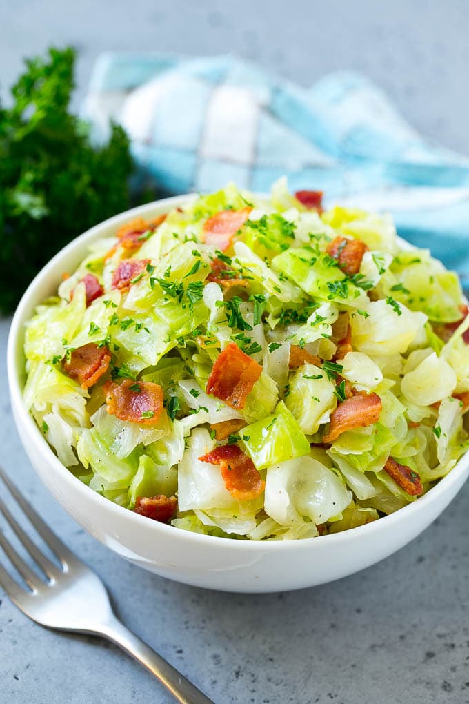 Fried Cabbage Recipe | Cabbage with Bacon | Cabbage Side Dish #cabbage #bacon #sidedish #lowcarb #keto #ezlod A bowl of fried cabbage topped with bacon and parsley.