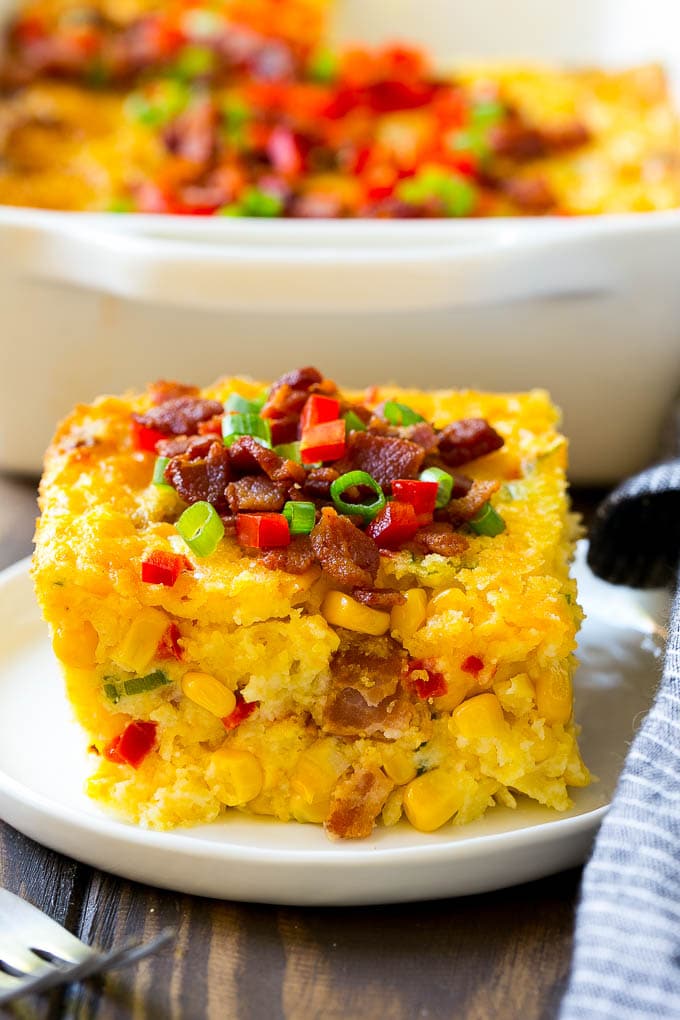 Loaded Corn Casserole Recipe | Easy Corn Casserole | Bacon Corn Casserole | Corn Pudding #corn #casserole #bacon #cheese #sidedish #thanksgiving #dinner #ezlod A serving of corn casserole filled with bacon, cheese and peppers.