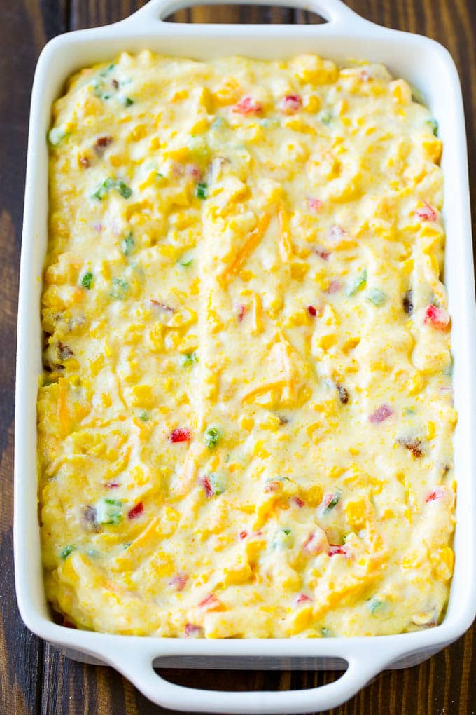 Loaded Corn Casserole Recipe | Easy Corn Casserole | Bacon Corn Casserole | Corn Pudding #corn #casserole #bacon #cheese #sidedish #thanksgiving #dinner #ezlod Uncooked batter in a baking dish.