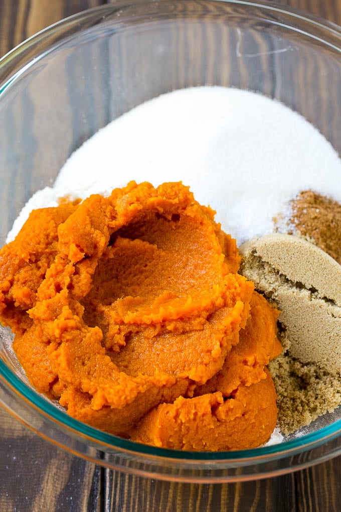Pumpkin Bars Recipe | Pumpkin Cake | Pumpkin Dessert #pumpkin #fall #dessert #ezlod #thanksgiving Pumpkin puree, brown sugar and flour in a bowl.
