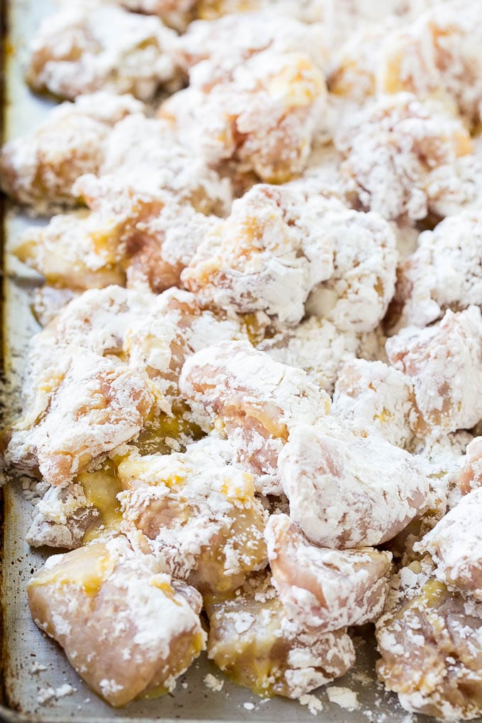 Sweet Chili Chicken Recipe | Thai Chicken | Asian Chicken #chicken #thaifood #chili #dinner #ezlod Chicken pieces coated in egg and flour.