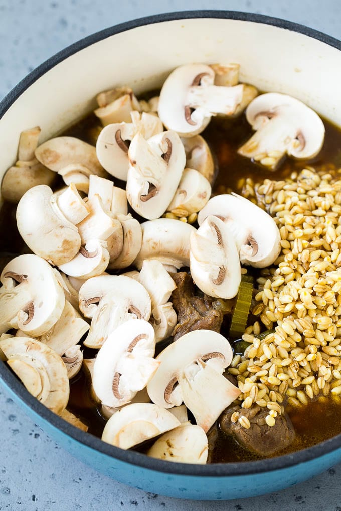 Beef Barley Soup Recipe | Beef Soup | Barley Soup #soup #beef #dinner #vegetables #ezlod #comfortfood Beef barley soup with sliced mushrooms and barley stirred in.