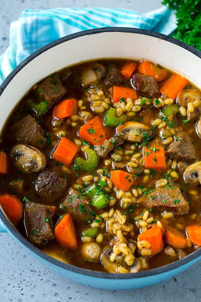 Beef Barley Soup Recipe | Beef Soup | Barley Soup #soup #beef #dinner #vegetables #ezlod #comfortfood A pot full of beef barley soup made with beef stew meat, barley and vegetables all simmered together.
