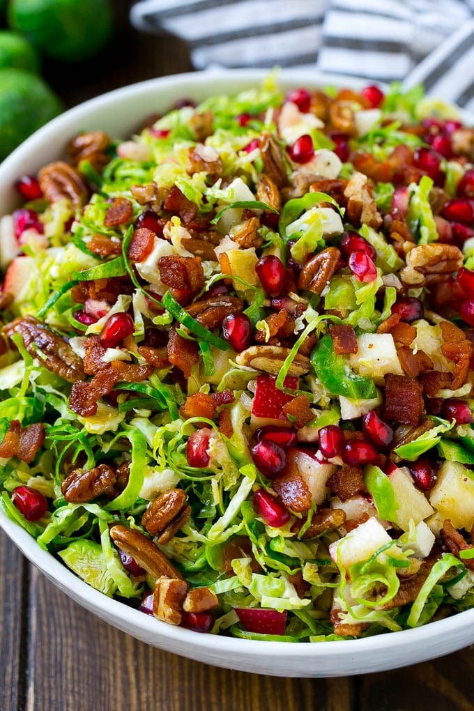 Brussels Sprout Salad Recipe | Shredded Brussels Sprouts Salad | Fall Salad #salad #brusselssprouts #bacon #thanksgiving #pomegranate #apple #dinner #ezlod Brussels sprout salad with shredded brussels sprouts, pomegranate, pecans, feta cheese, apples and bacon.