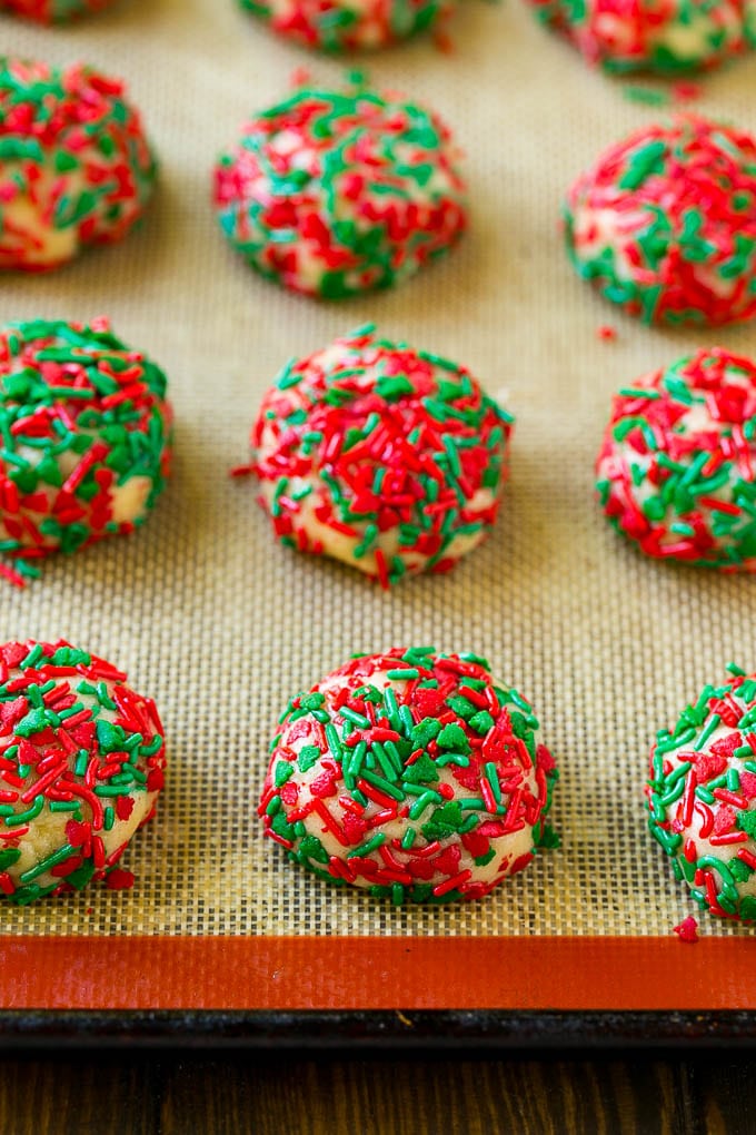 Cake Mix Cookies Recipe | Sprinkle Cookies | Christmas Cookies #cookies #christmas #sprinkles #dessert #baking #ezlod Balls of dough rolled in sprinkles.
