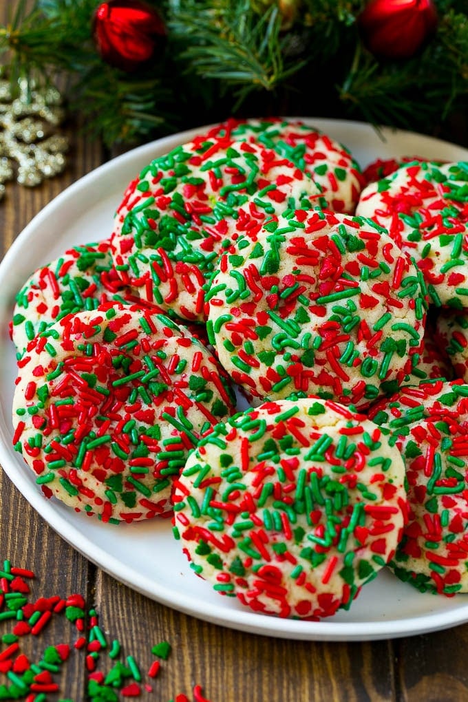 Cake Mix Cookies Recipe | Sprinkle Cookies | Christmas Cookies #cookies #christmas #sprinkles #dessert #baking #ezlod A plate of cake mix cookies rolled in colorful sprinkles.