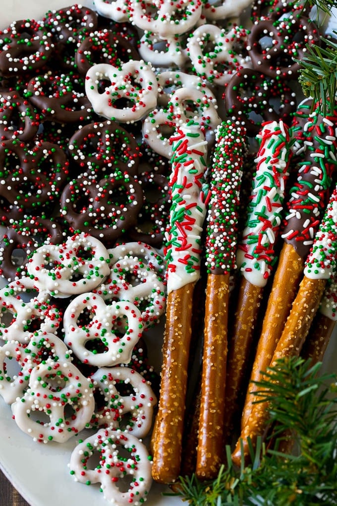 Chocolate Covered Pretzels Recipe | Sprinkle Pretzels | No Bake Dessert #pretzels #chocolate #christmas #sprinkles #candy #ezlod Chocolate covered pretzel twists and rods on a serving platter.