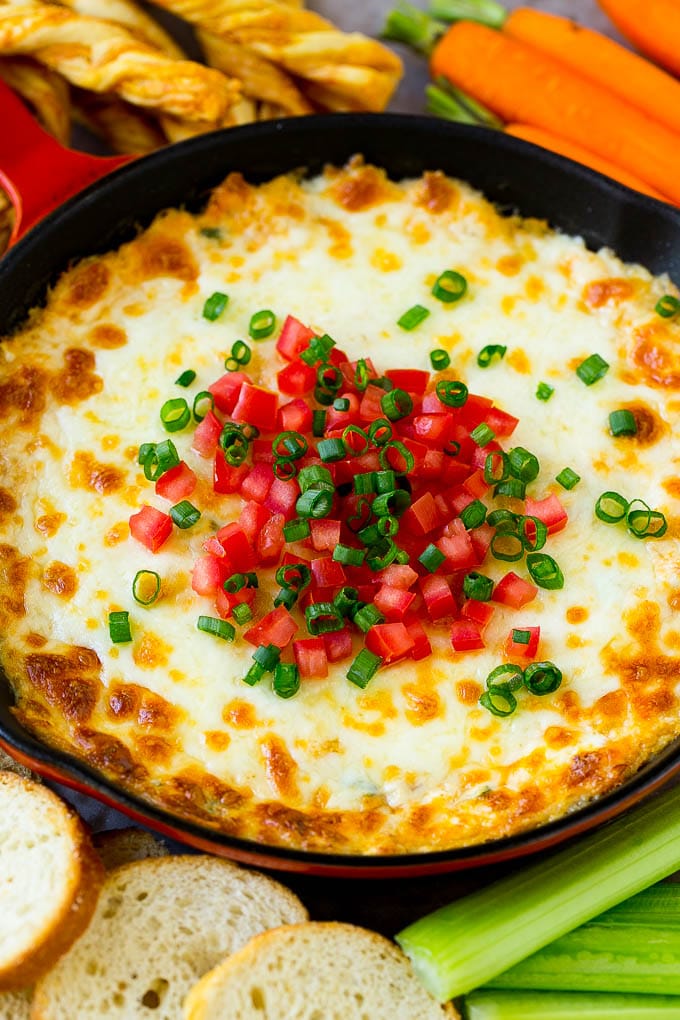 Crab Dip Recipe | Hot Crab Dip | Seafood Dip #dip #crab #seafood #appetizer #ezlod #cheese Hot crab dip in a skillet topped with tomatoes and green onions.