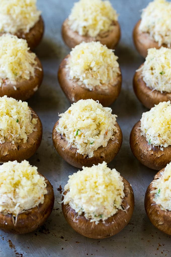 Crab Stuffed Mushrooms Recipe | Stuffed Mushrooms | Mushroom Appetizer #crab #seafood #mushrooms #lowcarb #appetizer #ezlod Uncooked crab stuffed mushrooms on a sheet pan.