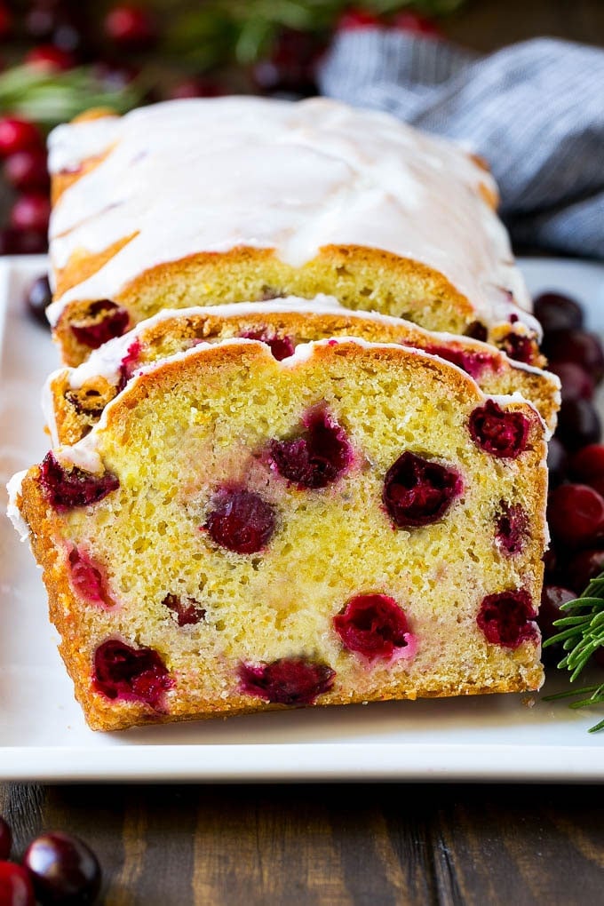 Cranberry Bread Recipe | Cranberry Loaf | Cranberry Orange Bread #cranberry #bread #baking #dessert #fall #ezlod Sliced cranberry bread on a serving plate.