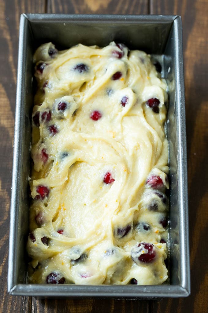 Cranberry Bread Recipe | Cranberry Loaf | Cranberry Orange Bread #cranberry #bread #baking #dessert #fall #ezlod Ccranberry bread batter spread into a loaf pan.