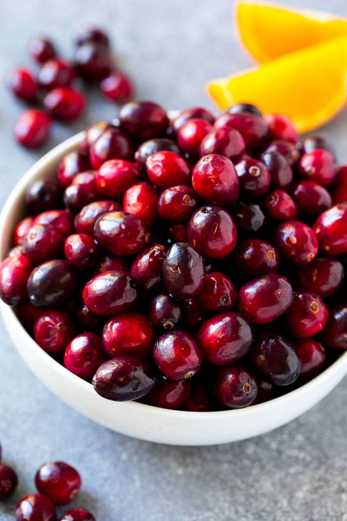 Cranberry Orange Sauce Recipe | Homemade Cranberry Sauce | Fresh Cranberry Sauce #cranberry #orange #fall #thanksgiving #sauce #dinner #ezlod A bowl of fresh cranberries.