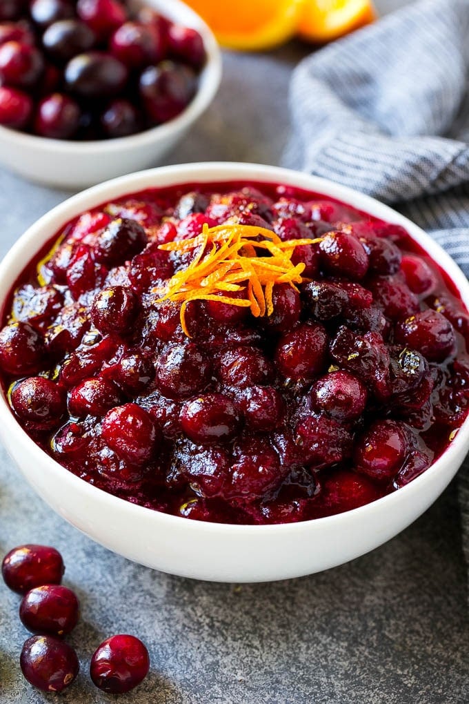 Cranberry Orange Sauce Recipe | Homemade Cranberry Sauce | Fresh Cranberry Sauce #cranberry #orange #fall #thanksgiving #sauce #dinner #ezlod A bowl of cranberry orange sauce topped with fresh orange zest.