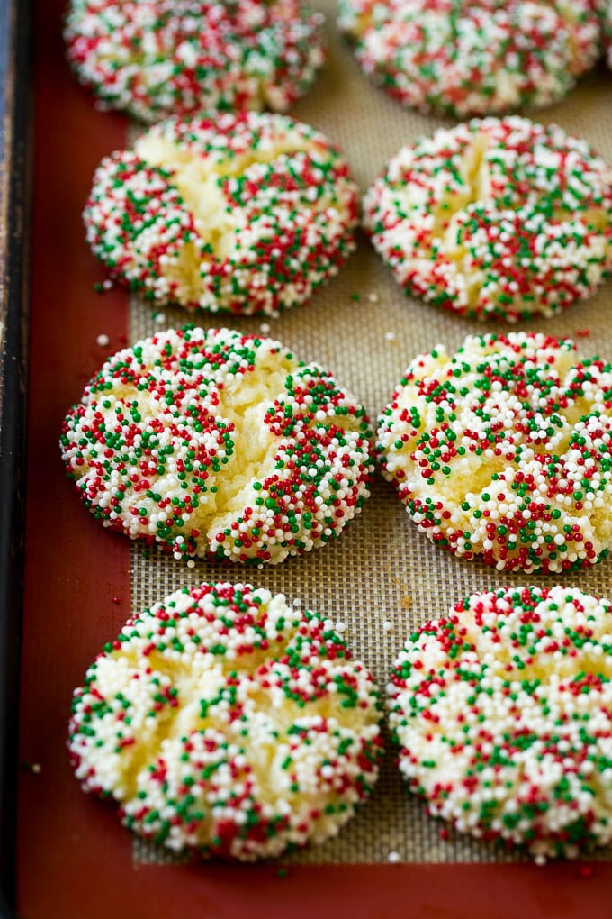 Gooey Butter Cookies Recipe | Cake Mix Cookies | Sprinkle Cookies | Christmas Cookies #cookies #butter #sprinkles #christmas #dessert #baking #ezlod Baked gooey butter cookies on a sheet pan.