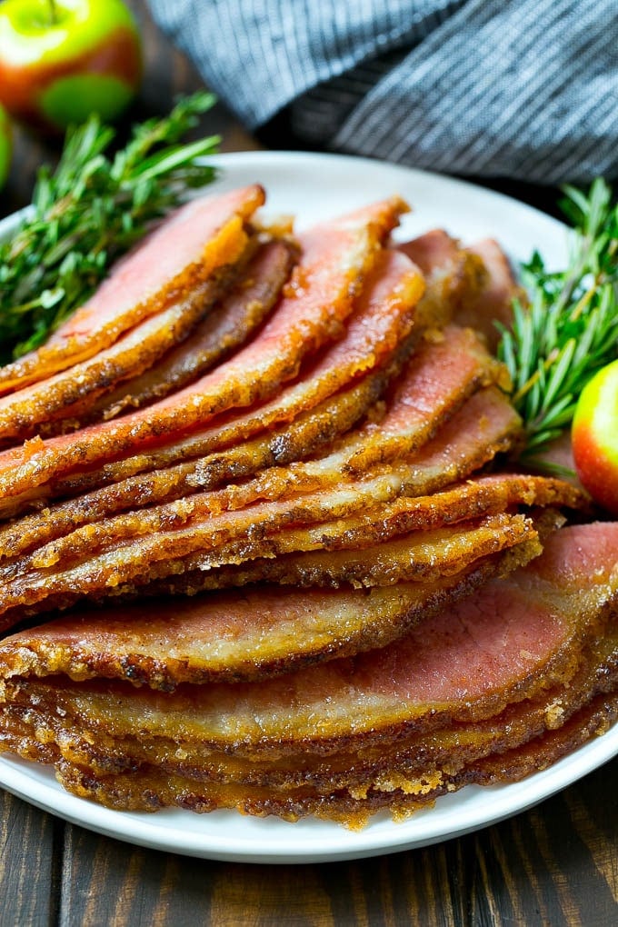 Honey Baked Ham Recipe | Glazed Ham | Holiday Ham #ham #dinner #ezlod #christmas #thanksgiving #easter Sliced honey baked ham on a serving plate.