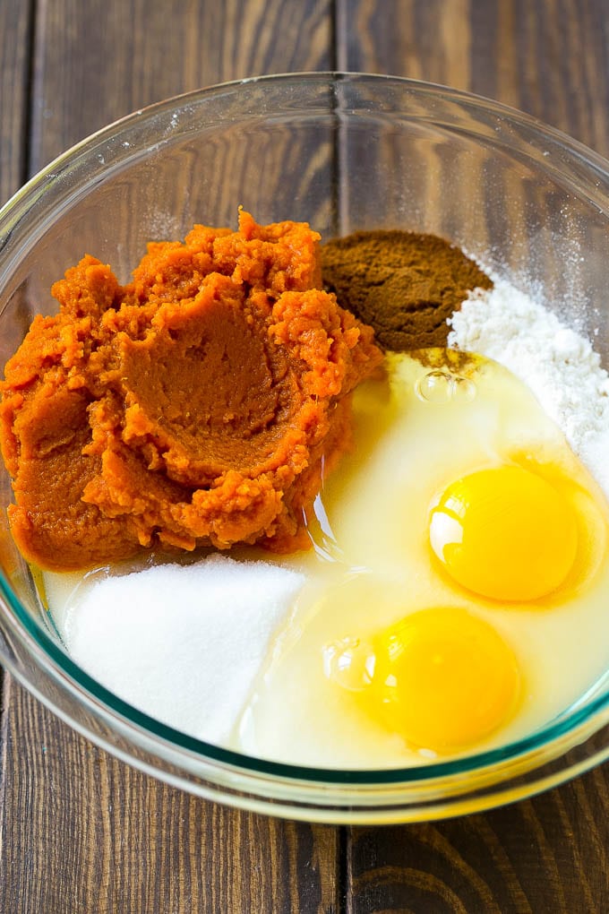Pumpkin Chocolate Chip Bread Recipe | Pumpkin Bread | Chocolate Pumpkin Bread #pumpkin #bread #fall #chocolate #baking #dessert #ezlod Sugar, eggs, pumpkin puree, flour and spices in a mixing bowl.