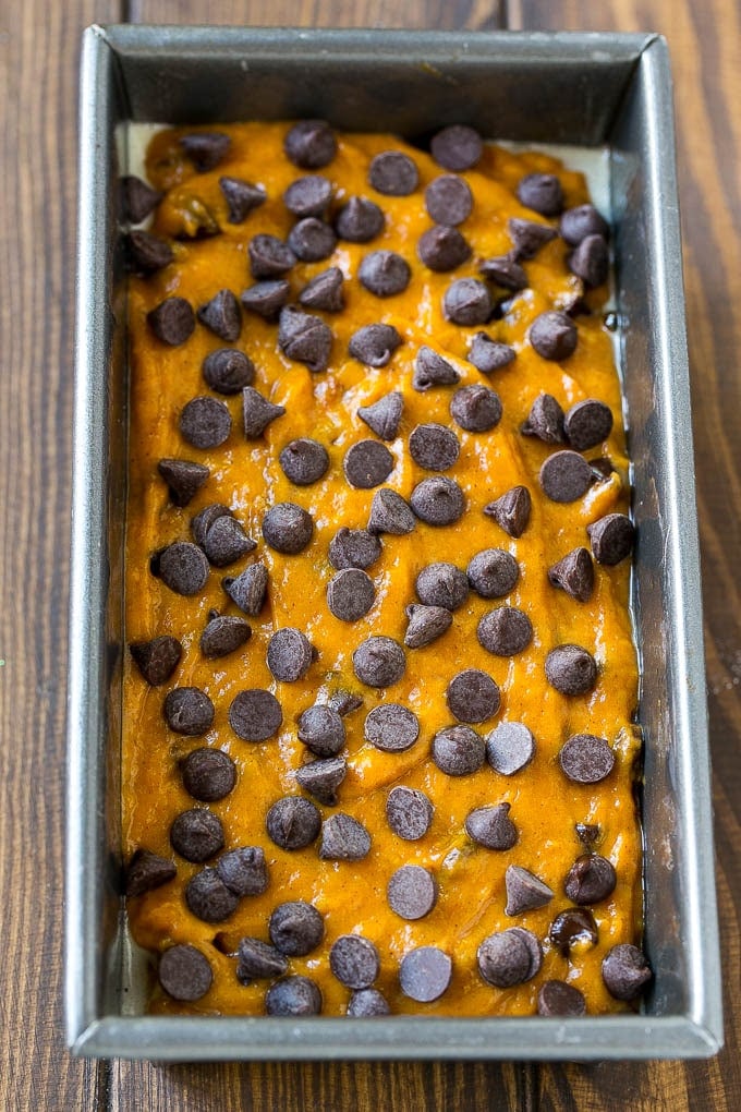 Pumpkin Chocolate Chip Bread Recipe | Pumpkin Bread | Chocolate Pumpkin Bread #pumpkin #bread #fall #chocolate #baking #dessert #ezlod A loaf pan of pumpkin chocolate chip bread batter.