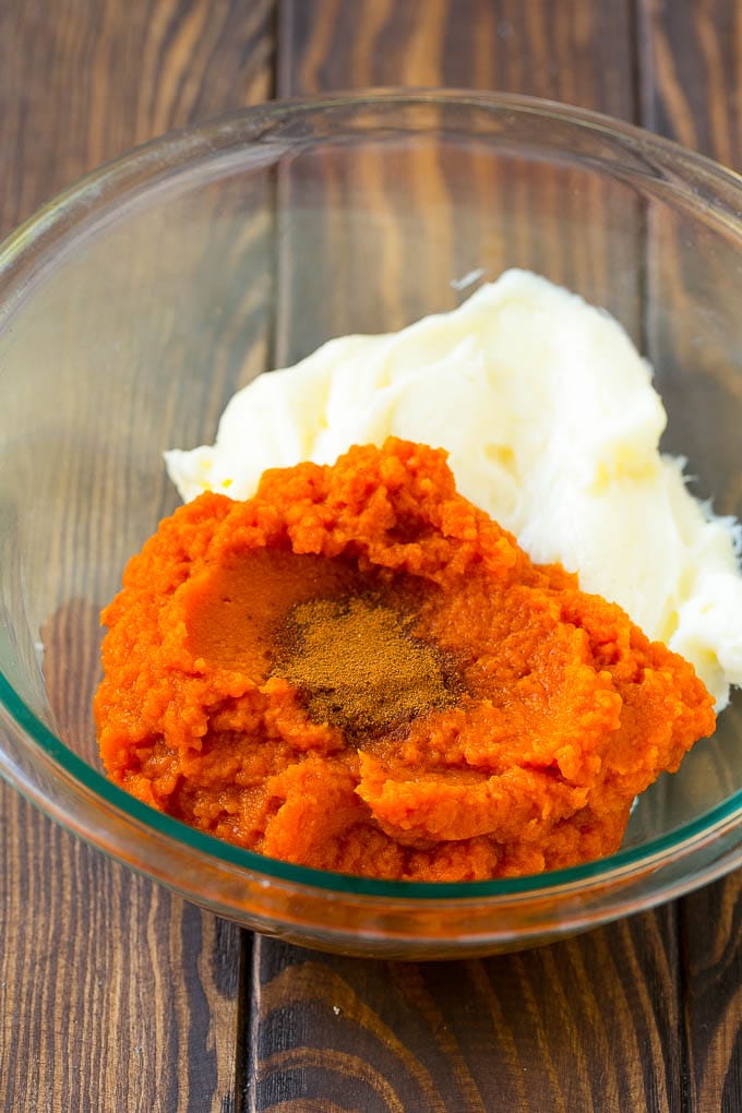 Pumpkin Dip Recipe | Dessert Dip | Pumpkin Pie Dip #pumpkin #dessert #dip #fall #thanksgiving #ezlod Puree, cream cheese and spices in a bowl.