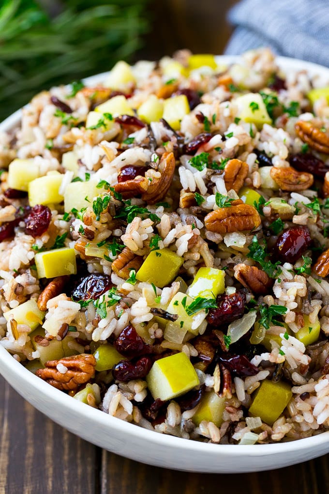 Wild Rice Pilaf Recipe | Thanksgiving Side Dish | Rice Pilaf #rice #apple #cranberry #fall #glutenfree #thanksgiving #ezlod A serving bowl of rice pilaf made with wild rice, apples, cranberries and pecans.