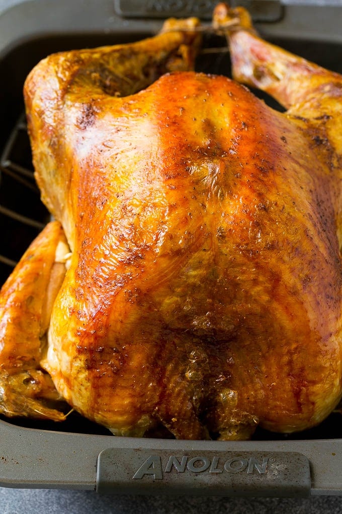 Roast Turkey Recipe | Thanksgiving Turkey | Holiday Turkey | Baked Turkey #turkey #thanksgiving #christmas #dinner #glutenfree #ezlod A roasted turkey in a baking pan.