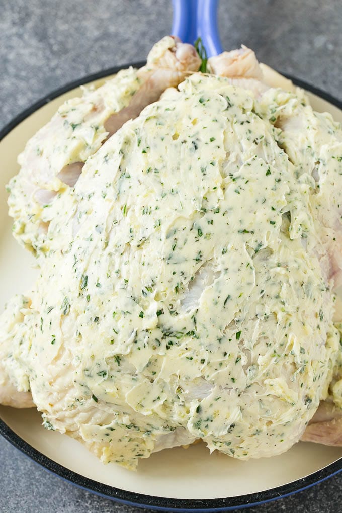 Roasted Chicken Recipe | Whole Roasted Chicken | Roast Chicken #chicken #dinner #lowcarb #keto #ezlod A raw whole chicken coated in garlic and herb butter.