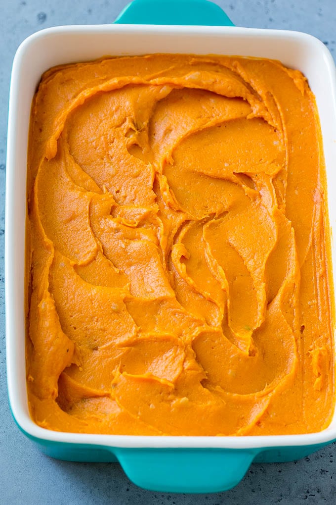 Ruth's Chris Sweet Potato Casserole Recipe | Sweet Potato Casserole | Mashed Sweet Potatoes #sweetpotatoes #casserole #thanksgiving #christmas #holidays #dinner #ezlod #sidedish A pan of mashed sweet potatoes.