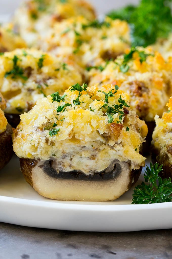 Sausage Stuffed Mushrooms Recipe | Stuffed Mushrooms | Mushroom Appetizer #mushrooms #sausage #appetizer #lowcarb #keto #ezlod A cross section of a sausage stuffed mushroom on a serving platter.