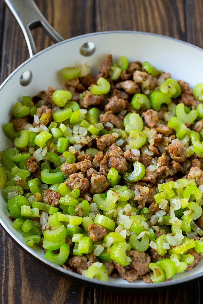 Sausage Stuffing Recipe | Thanksgiving Stuffing | Make Ahead Stuffing #stuffing #thanksgiving #sausage #sidedish #dinner #ezlod A pan of cooked sausage, celery and onions.