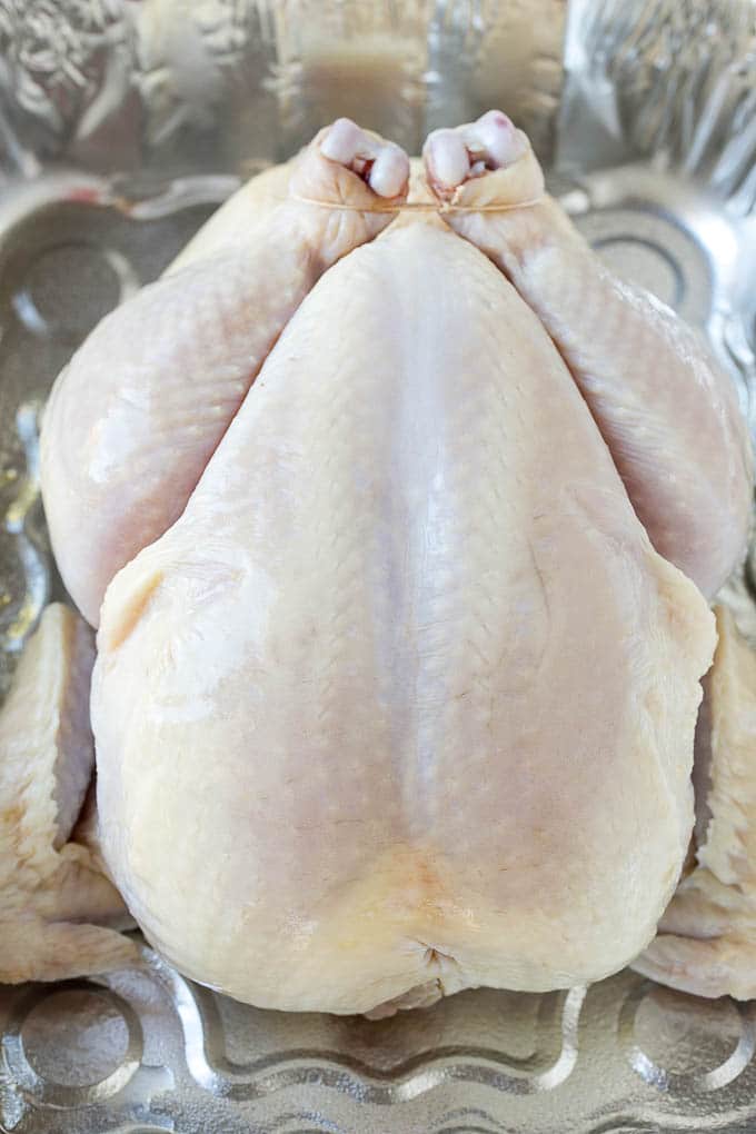 Smoked Chicken Recipe | Whole Smoked Chicken | BBQ Chicken #chicken #smoker #BBQ #dinner #ezlod #glutenfree #lowcarb Raw poultry in a roasting pan.