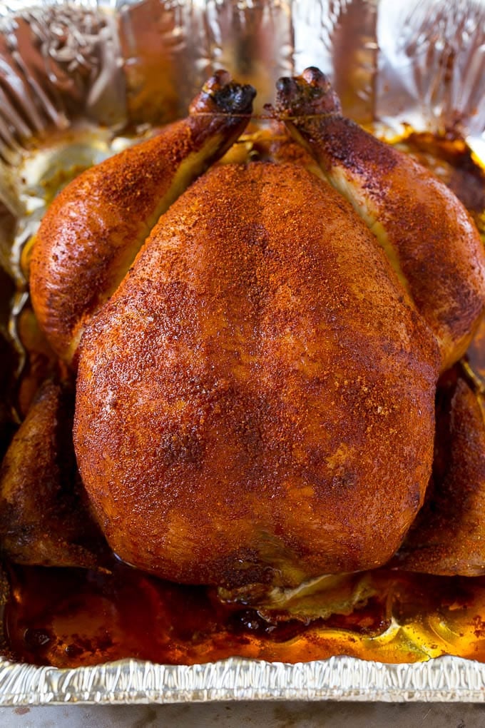 Smoked Chicken Recipe | Whole Smoked Chicken | BBQ Chicken #chicken #smoker #BBQ #dinner #ezlod #glutenfree #lowcarb A whole smoked chicken in a roasting pan.