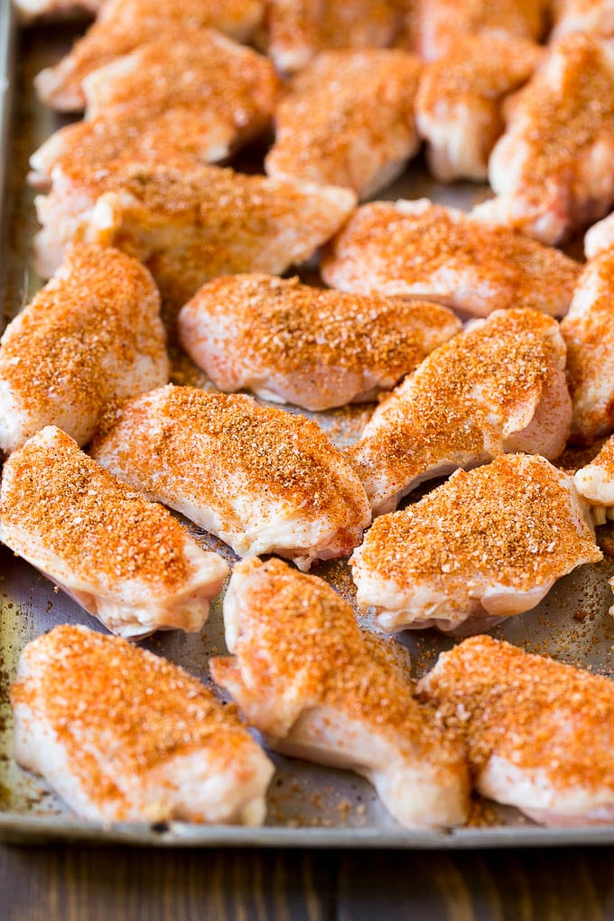 Smoked Chicken Wings | Barbecue Chicken Wings | BBQ Chicken Wings #chicken #wings #bbq #barbecue #appetizer #dinner #ezlod Raw chicken wings coated in homemade spice rub on a sheet pan.