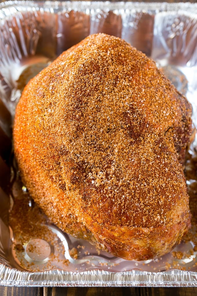 Brown Sugar Smoked Ham Recipe | Holiday Ham Recipe | Brown Sugar Glazed Ham #ham #christmas #thanksgiving #easter #smoker #dinner #brownsugar #ezlod #glutenfree A ham crusted in homemade spice rub, ready to go into the smoker.