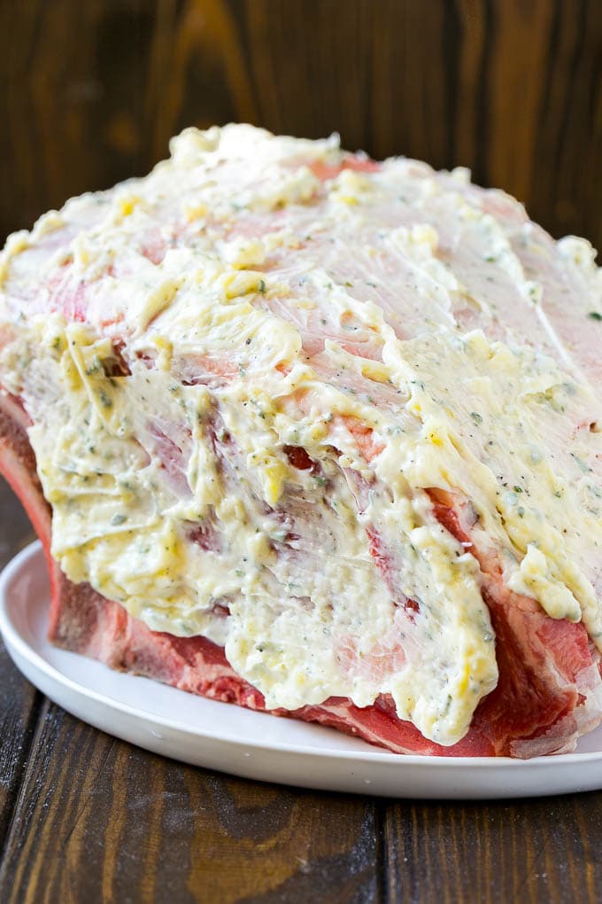 Smoked Prime Rib Recipe | Easy Prime Rib | Smoked Beef | Holiday Prime Rib #primerib #beef #smoker #dinner #ezlod #christmas #thanksgiving #lowcarb #keto A roast coated in garlic and herb butter.