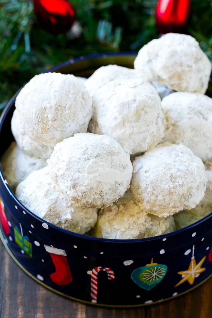 Snowball Cookies Recipe | Mexican Wedding Cookies | Russian Tea Cakes #cookies #pecan #chocolate #baking #dessert #christmas #ezlod Snowball cookies coated in powdered sugar and served in a holiday tin,