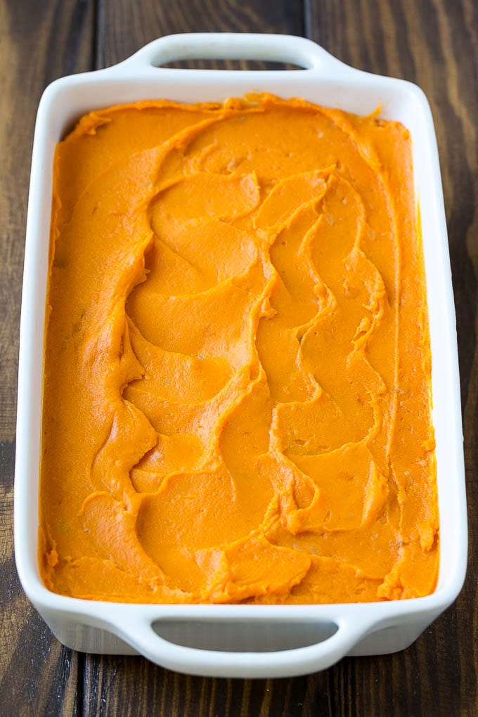 Sweet Potato Casserole with Pecans Recipe | Sweet Potato Casserole | Sweet Potato Side Dish #sweetpotatoes #thanksgiving #pecans #casserole #sidedish #holiday #fall #ezlod Mashed sweet potatoes in a baking dish.