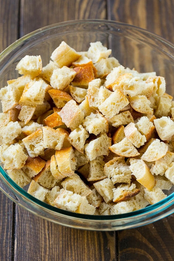 Turkey Stuffing Recipe | Thanksgiving Stuffing | Classic Stuffing #thanksgiving #stuffing #sidedish #fall #ezlod Dried bread cubes in a mixing bowl.