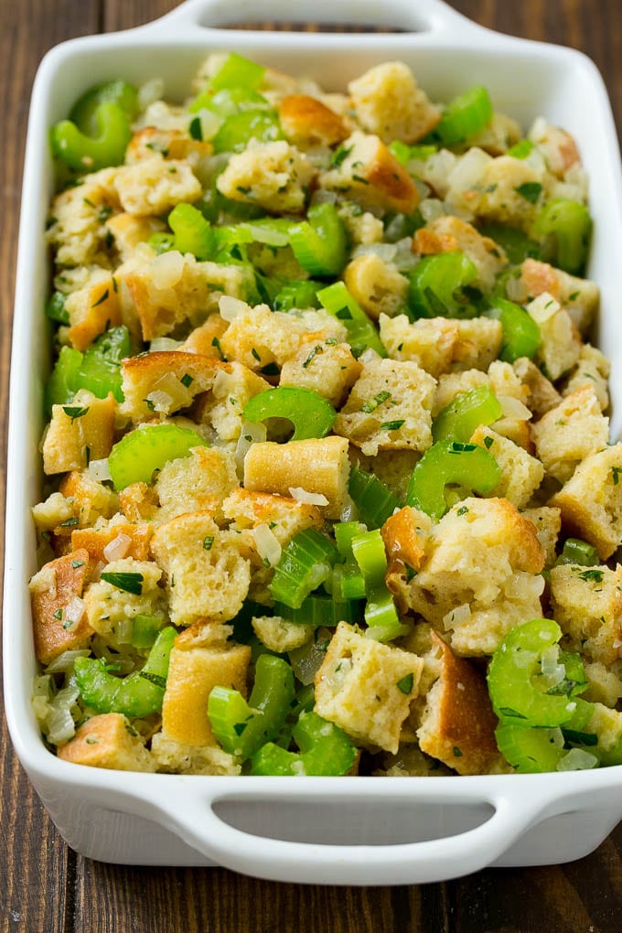 Turkey Stuffing Recipe | Thanksgiving Stuffing | Classic Stuffing #thanksgiving #stuffing #sidedish #fall #ezlod Uncooked holiday stuffing in a baking dish.