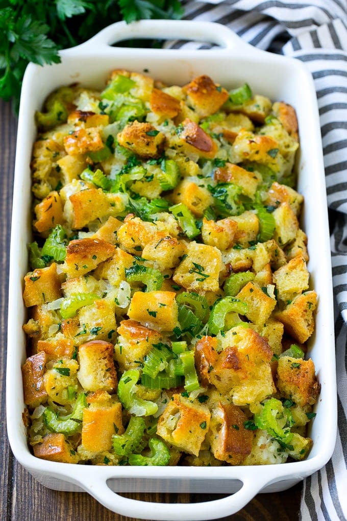 Turkey Stuffing Recipe | Thanksgiving Stuffing | Classic Stuffing #thanksgiving #stuffing #sidedish #fall #ezlod Baked turkey stuffing in a dish topped with fresh parsley.