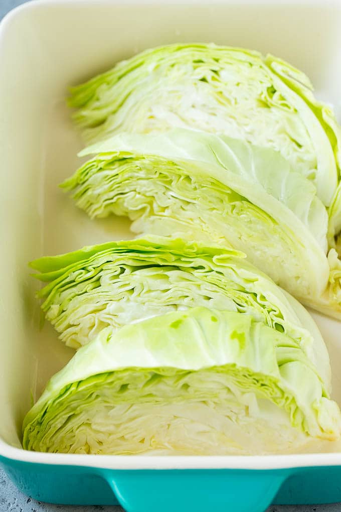 Braised Cabbage Recipe | Easy Cabbage Recipe #cabbage #lowcarb #keto #carrots #veggies #vegetarian #dinner #ezlod Wedges of cabbage in a baking dish.