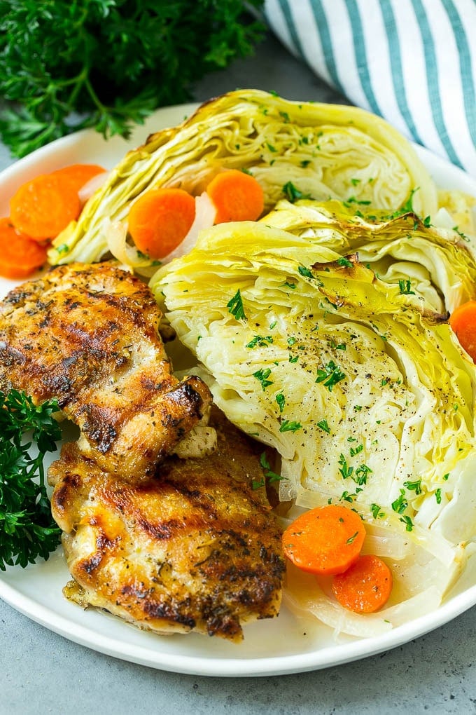 Braised Cabbage Recipe | Easy Cabbage Recipe #cabbage #lowcarb #keto #carrots #veggies #vegetarian #dinner #ezlod A plate of grilled chicken along with braised cabbage, carrots and onions.