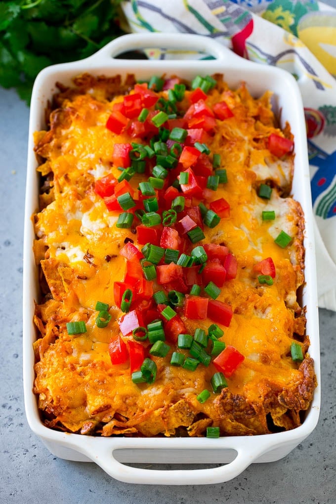 Dorito Casserole Recipe | Mexican Casserole | Beef Casserole #mexicanfood #beef #groundbeef #casserole #dinner #ezlod Dorito casserole topped with melted cheese, diced tomatoes and sliced green onions.