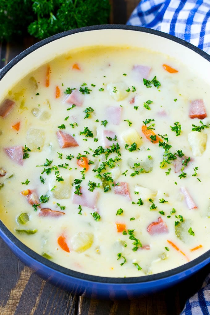 Ham and Potato Soup | Ham Soup | Potato Soup #soup #ham #potato #dinner #comfortfood #ezlod A pot of ham and potato soup with vegetables in a creamy broth, topped with parsley.
