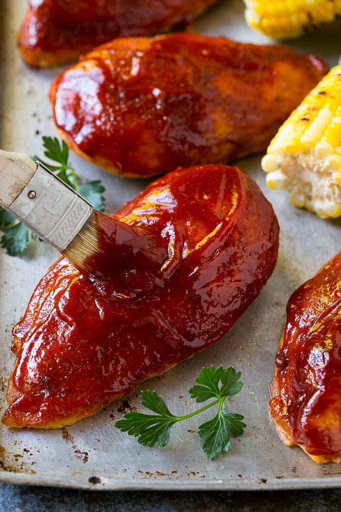Smoked Chicken Breast Recipe | BBQ Chicken | Smoked Chicken #bbq #chicken #smoker #dinner #glutenfree #ezlod Smoked chicken breasts being brushed with BBQ sauce.