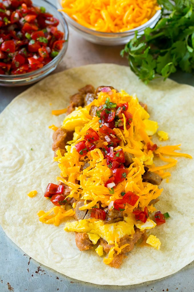 Breakfast Burrito Recipe | Sausage Breakfast Burrito #breakfast #sausage #eggs #burrito #ezlod A flour tortilla topped with eggs, sausage, cheese and pico de gallo salsa.