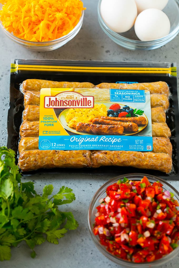 Breakfast Burrito Recipe | Sausage Breakfast Burrito #breakfast #sausage #eggs #burrito #ezlod A package of sausage links along with bowls of pico de gallo, eggs and shredded cheese.