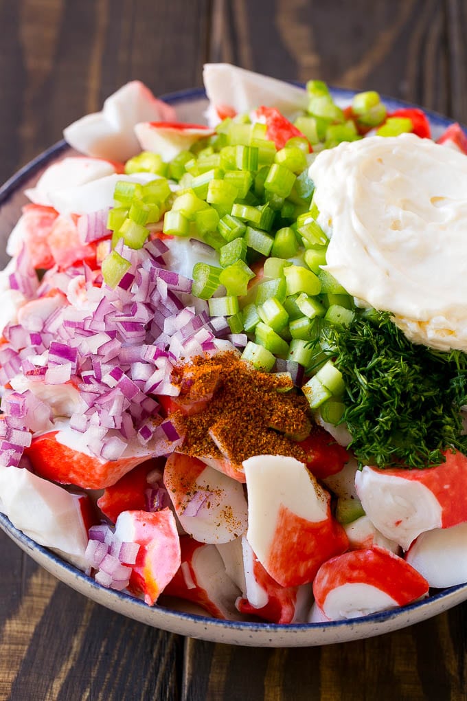Crab Salad Recipe | Seafood Salad | Deli Salad #crab #salad #seafood #lowcarb #keto #lunch #dinner #ezlod Imitation crab, seasoning, dill, celery and mayonnaise in a bowl.