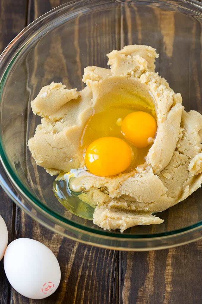 Eggnog Cookies Recipe | Holiday Cookies | Christmas Cookies #cookies #eggnog #baking #christmas #sprinkles #dessert #ezlod Butter, sugar and eggs in a mixing bowl.